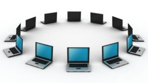 Circle of laptops representing the Best Laptops for Writers, arranged for collaboration and connectivity.
